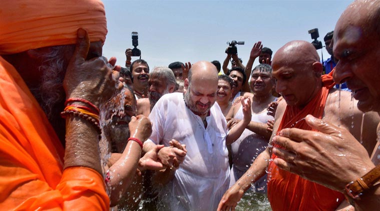 Politics at Kumbh: Amid controversy, Amit Shah takes holy dip with Dalit sadhus | The Indian Express